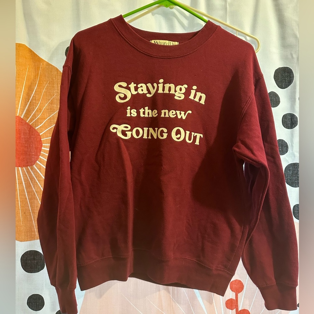 Maroon colored sweatshirt, perfect for a cozy night in.